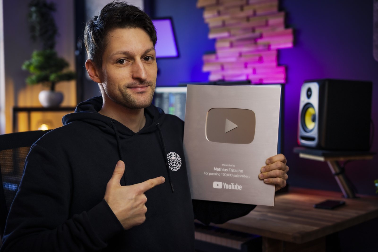 Mathias Fritsche in his studio with his YouTube Creator Award